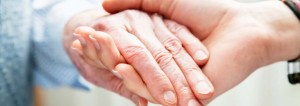 Care Partner Lending a Comforting Hand to Senior