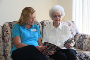 care team member reading with client